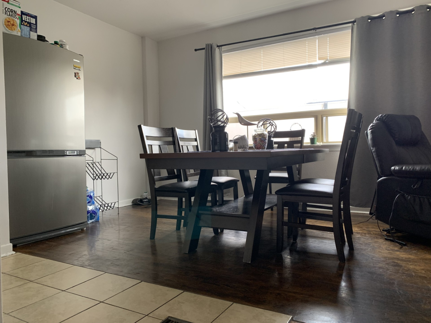 2877 Dufferin Street residential dining room with dining table, chairs and refrigerator