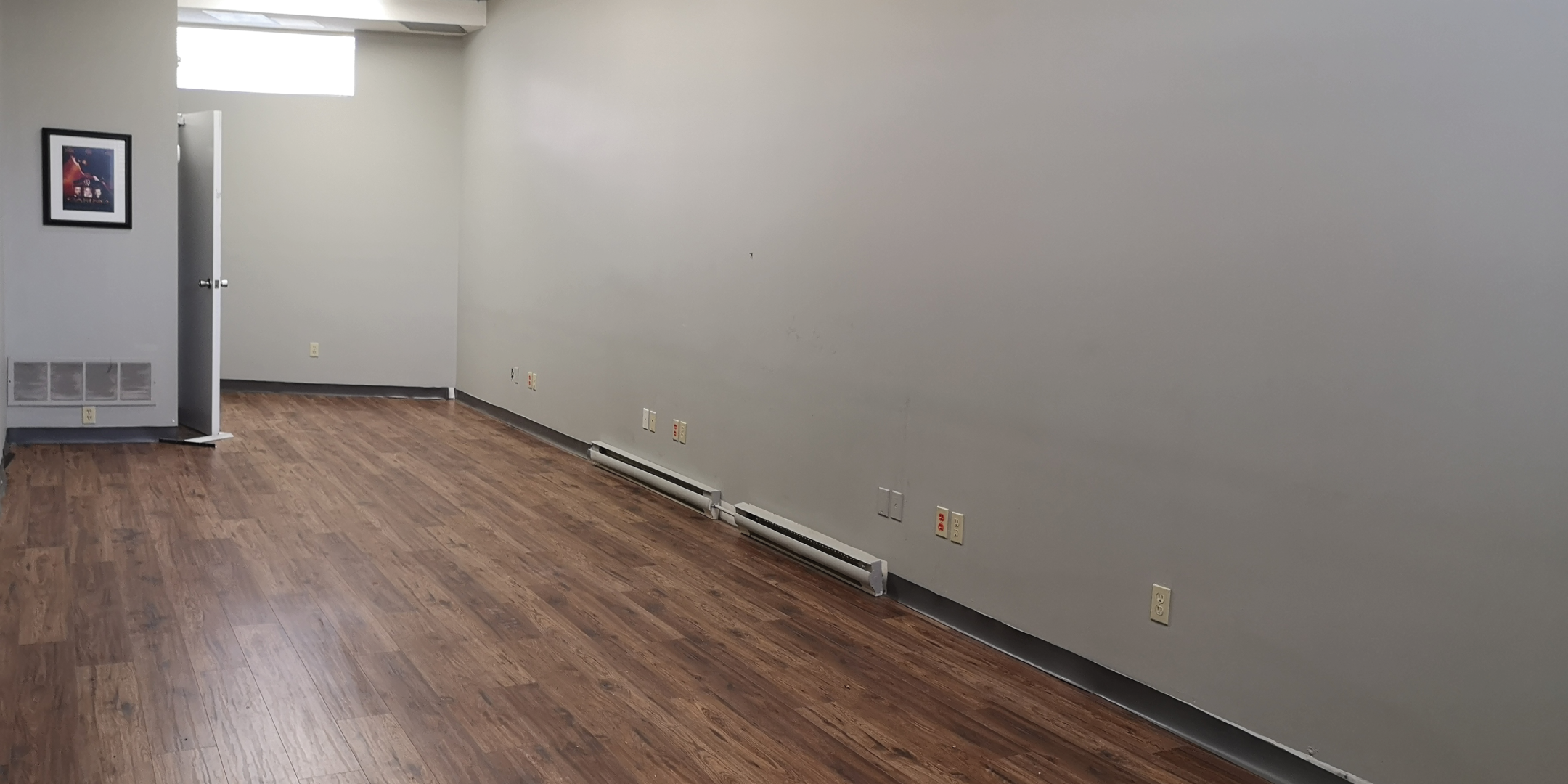 28 Main Street N Room with large window and hardwood floors