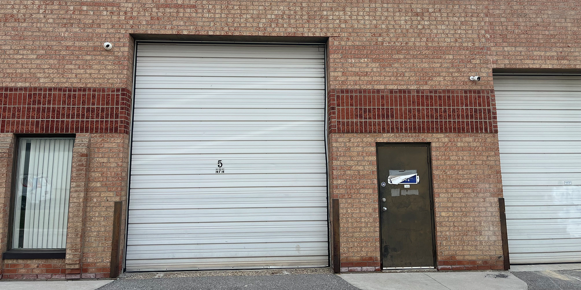 13 Edvac Drive - Rear exterior showing shipping door