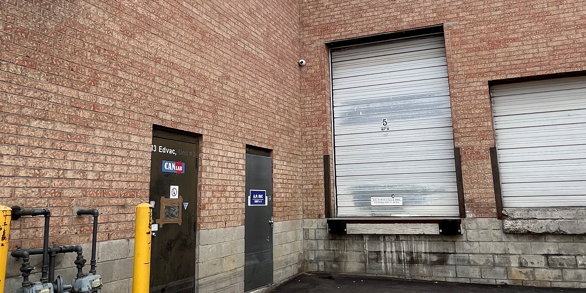 13 Edvac Drive - Rear exterior showing shipping door