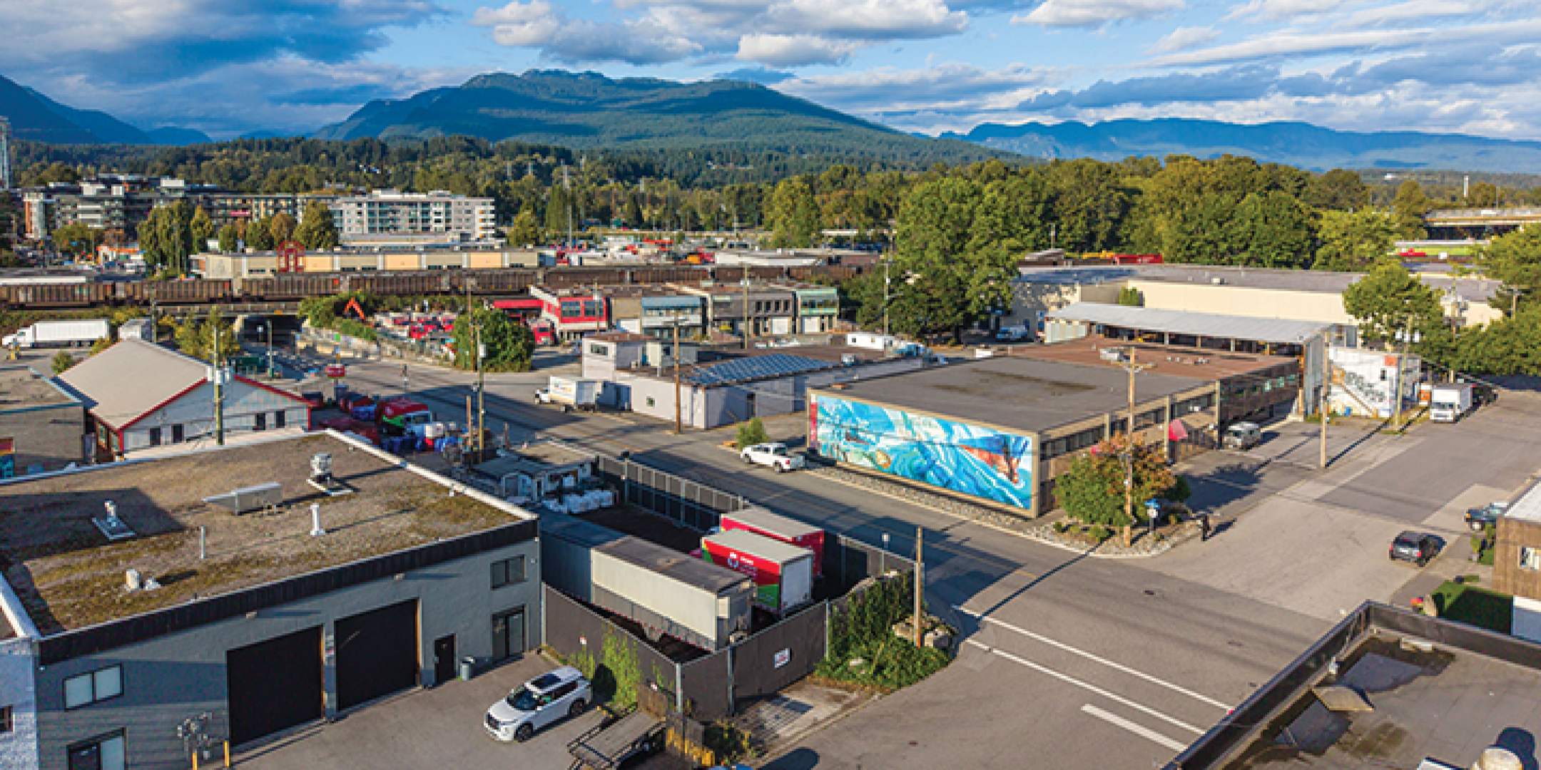 Aerial View of 1490 Columbia Street, including the industrial yard and showing the view of Vancouver