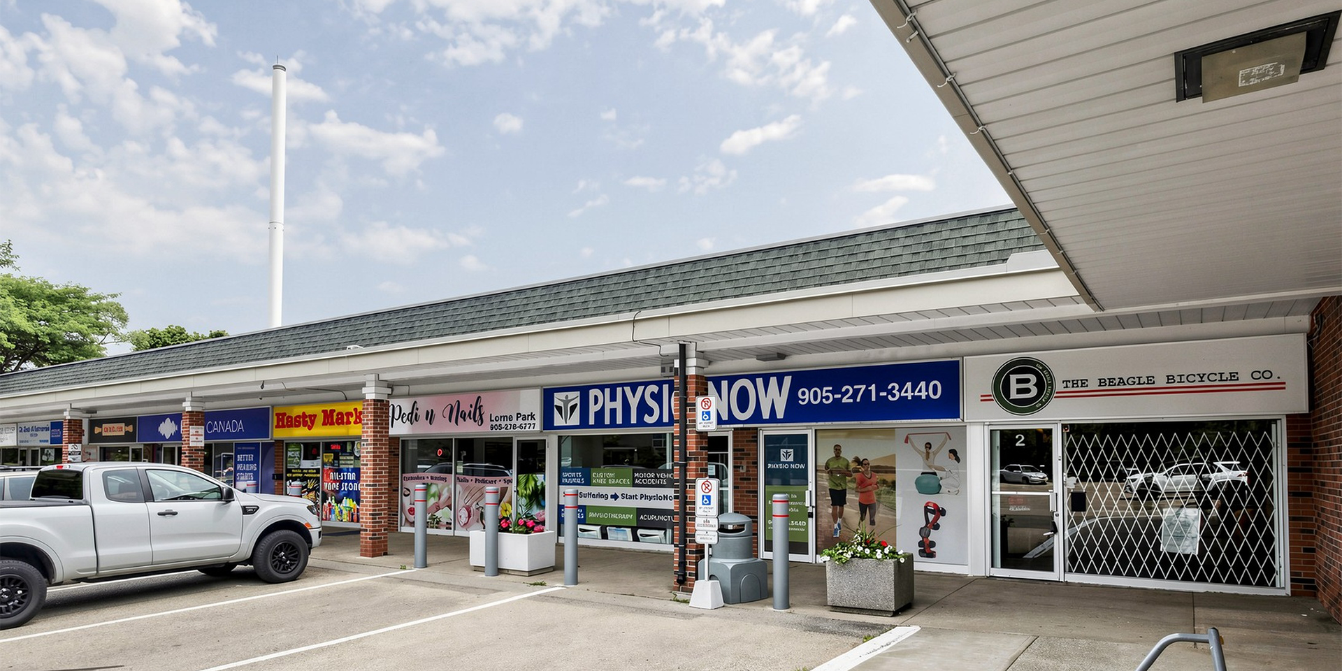 1150 Lorne Park Road Unit 2 - Front exterior showing other retail stores