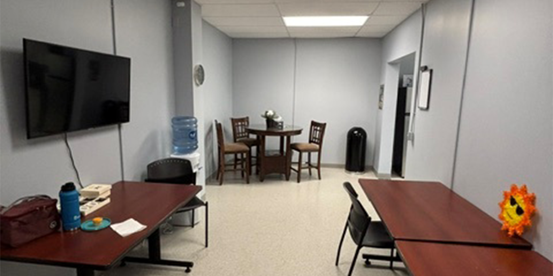 5420 North Service Road - Break Room showing tables, chairs, and TV