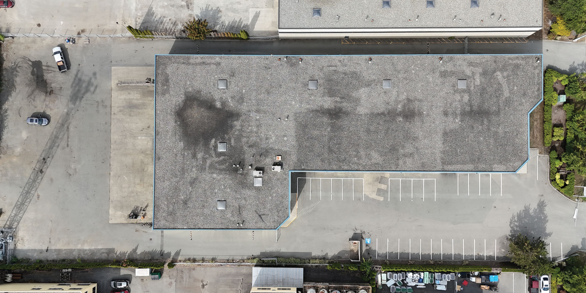 10167 199B Street bird's eye view of building and parking