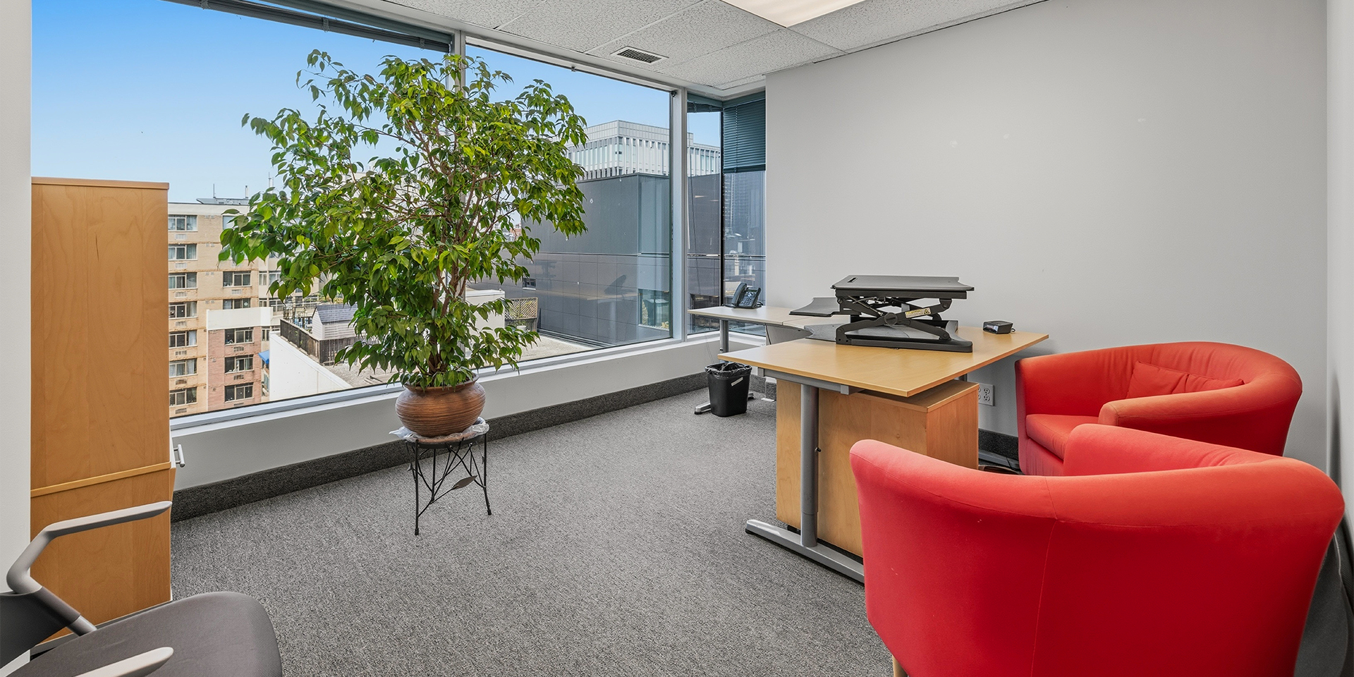 30 St Patrick Street Suite 900 office with huge windows and sofas