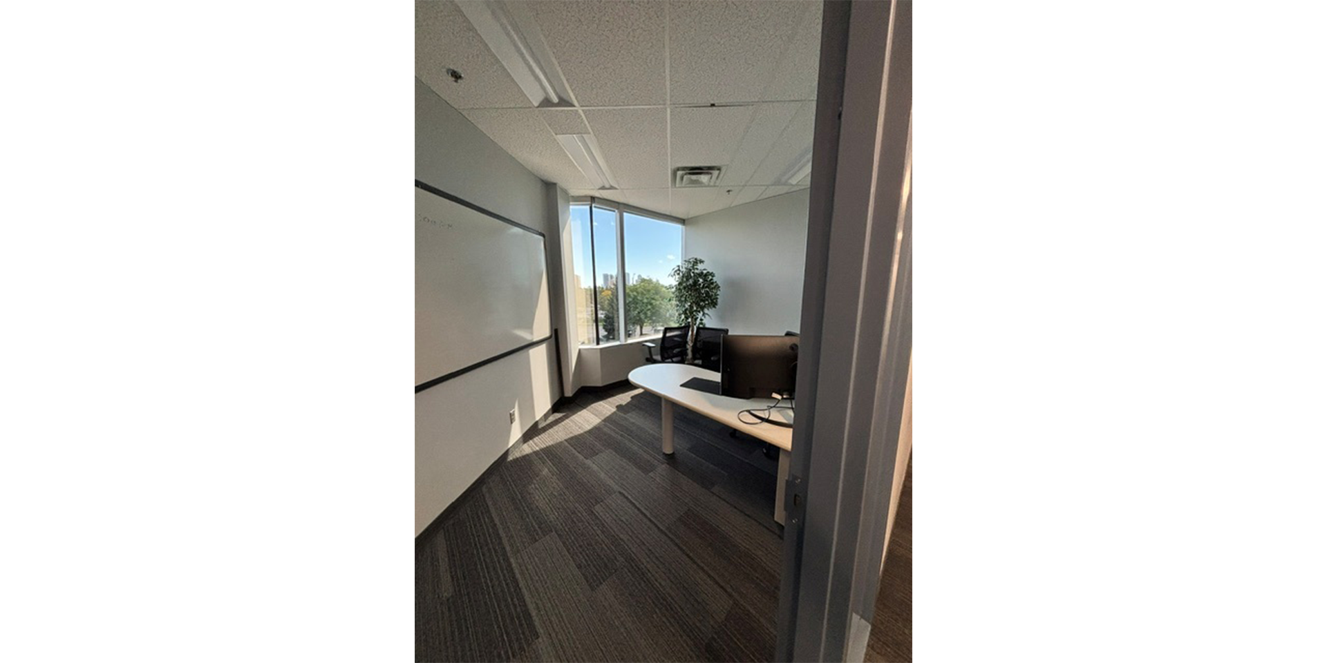 Another bright office with chairs and desk 320-110 Matheson Boulevard W
