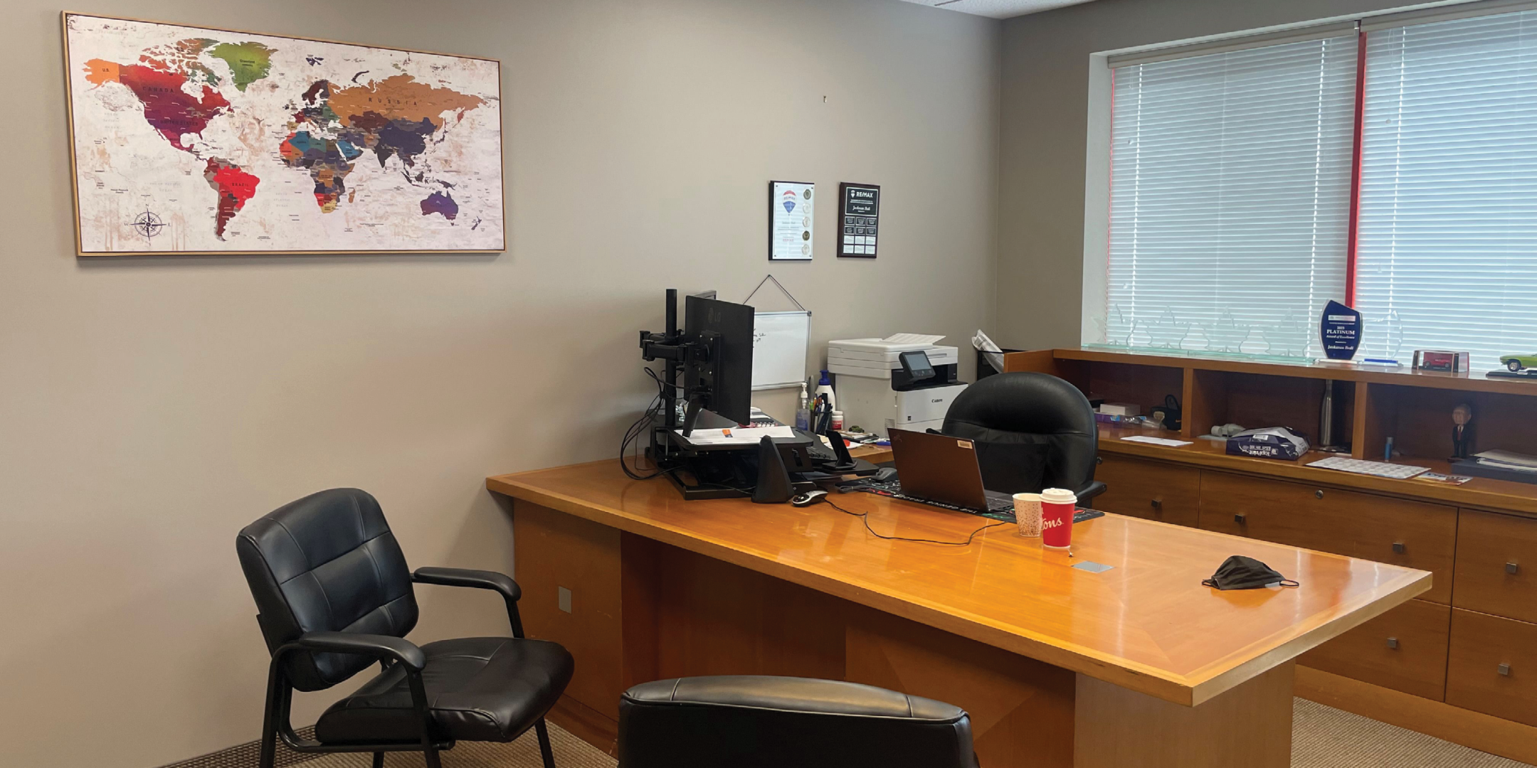 private office with desk and chairs