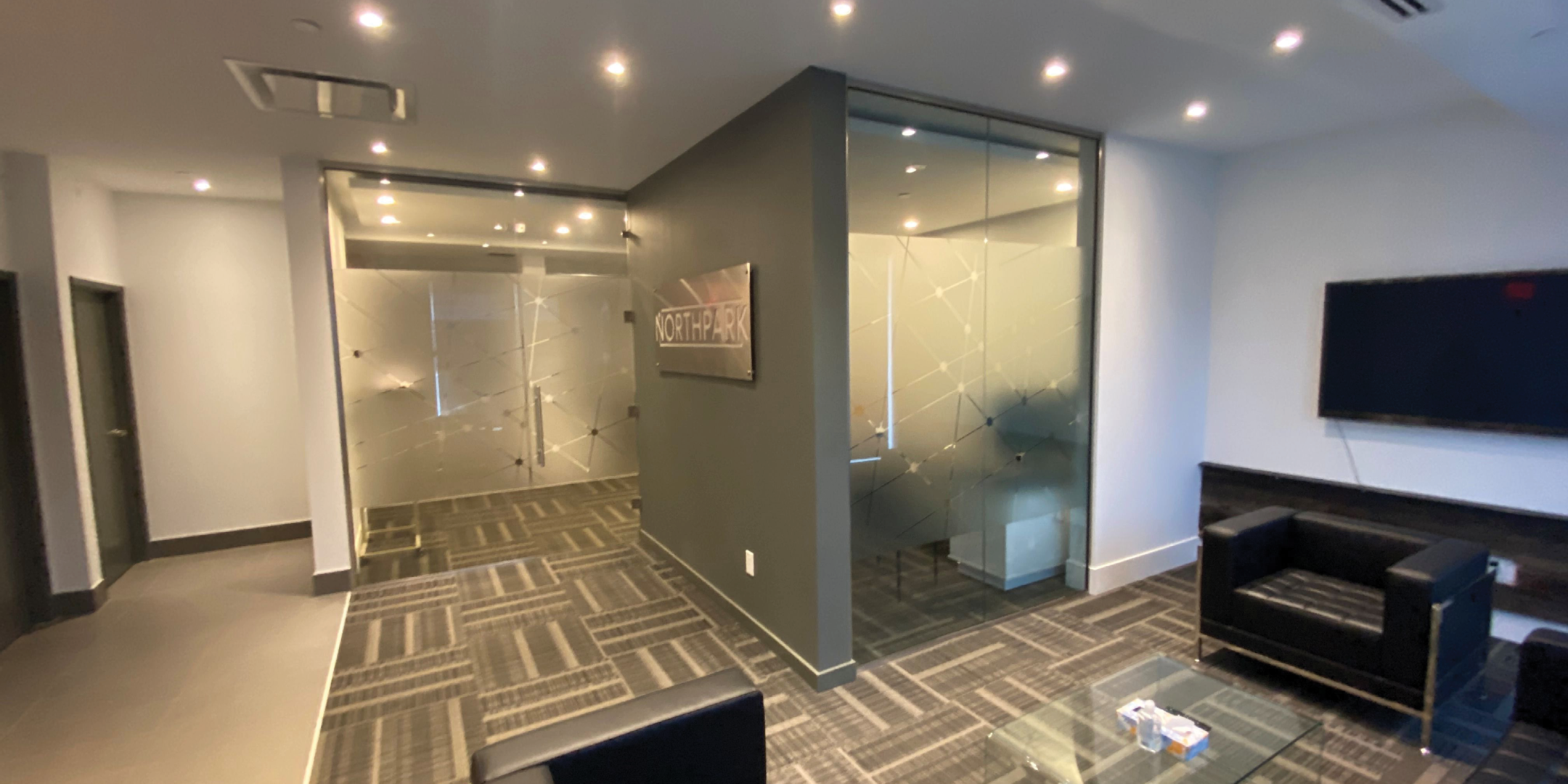 reception area with glass meeting room