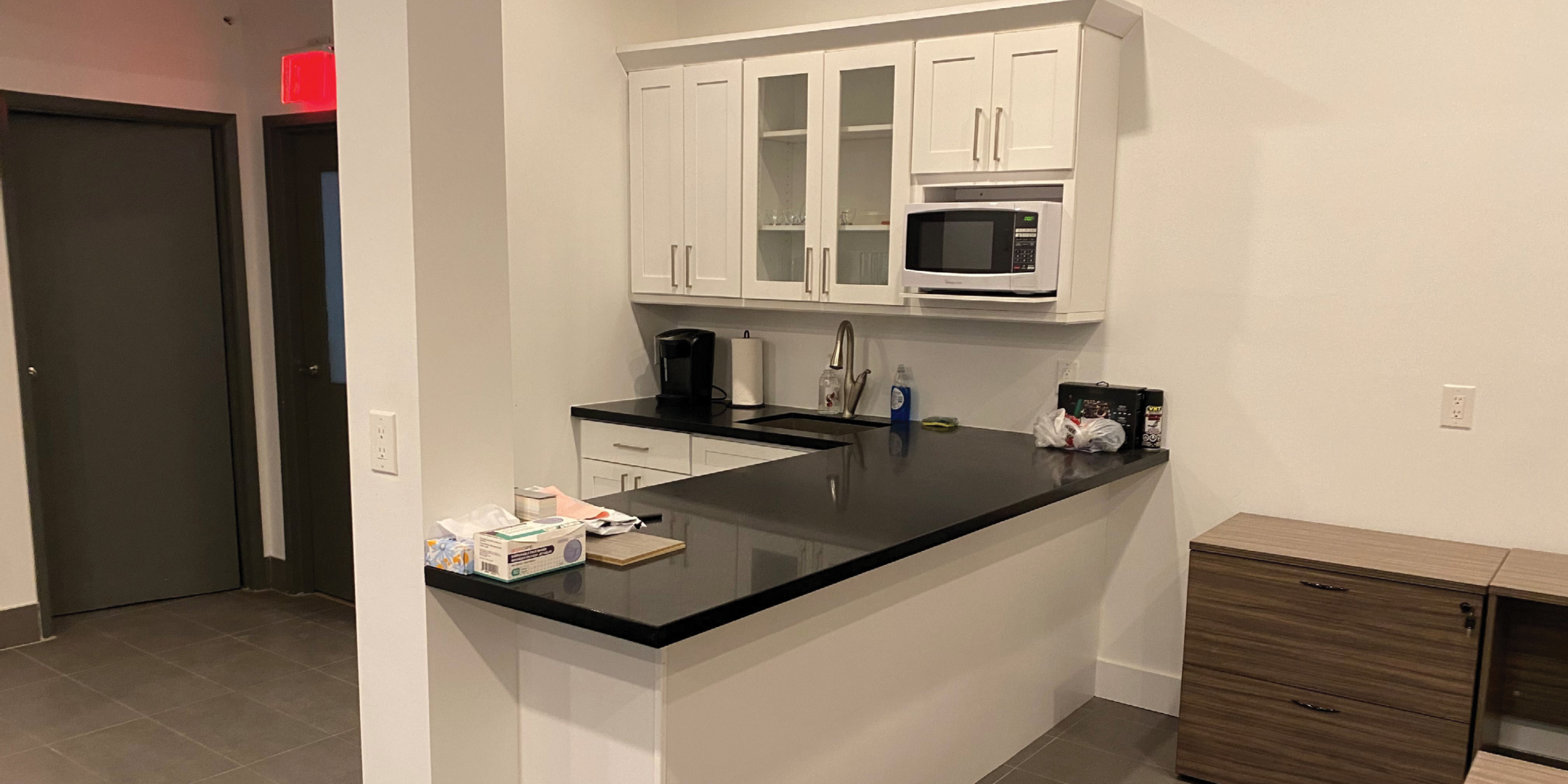 kitchenette with island and cupboards