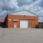 Front View of Building with Entrance and Shipping Door