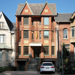 Photo of 3 story office building with red brick