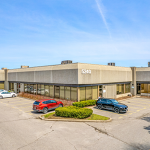 Corner of Industrial building showing street number