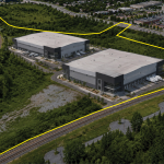 Aerial View of 2670 Walkley Road, with a yellow property outline and renderings of two potential industrial buildings