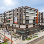 8188 Manitoba Street building exterior showing street corner, parking, and main entrance