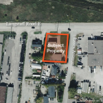 Aerial of land site with border of property outlined