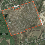 aerial of vacant land with overlay of site plan